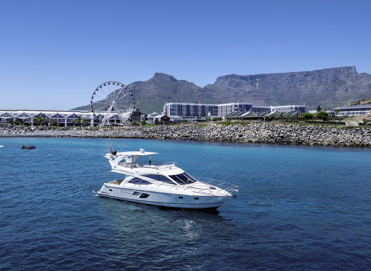 Luna Luxury Motor Yacht with V&A Waterfront & Table Mountain Backdrop