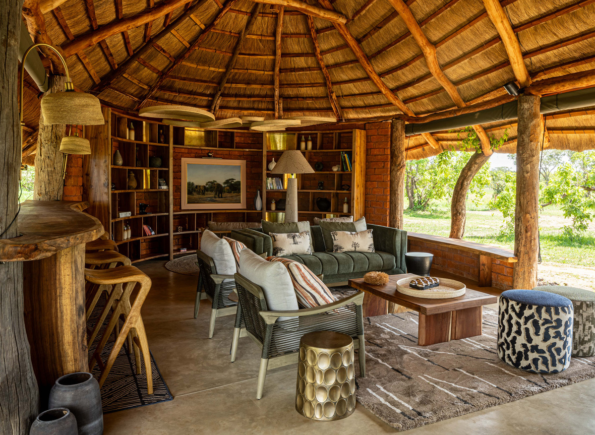 MAWIMBI Bush Camp - main lapa library view out towards natural wetland (dambo)