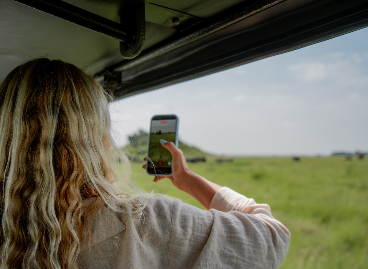 Safari Guest Capturing Wildlife Moments in the Serengeti