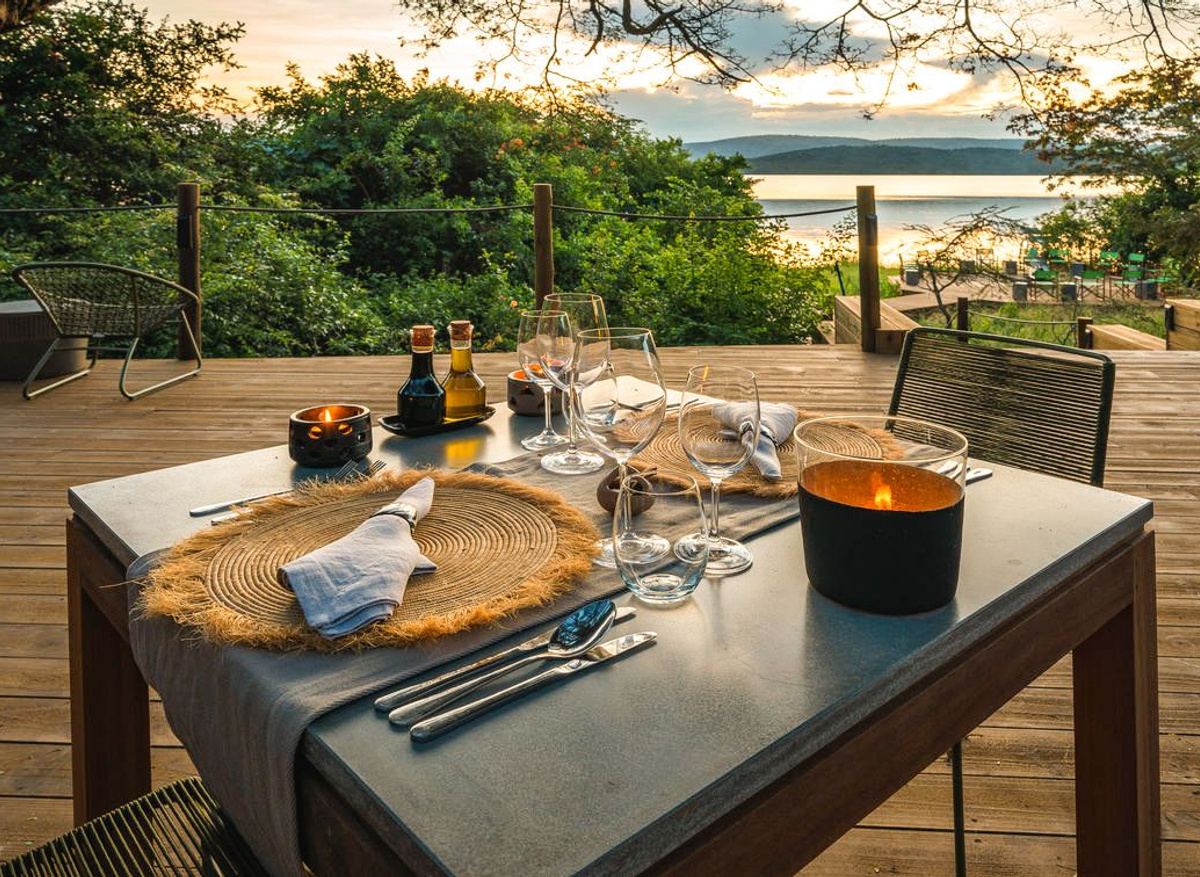 Dinner table with a stunning view of Lake Rwanyakazinga