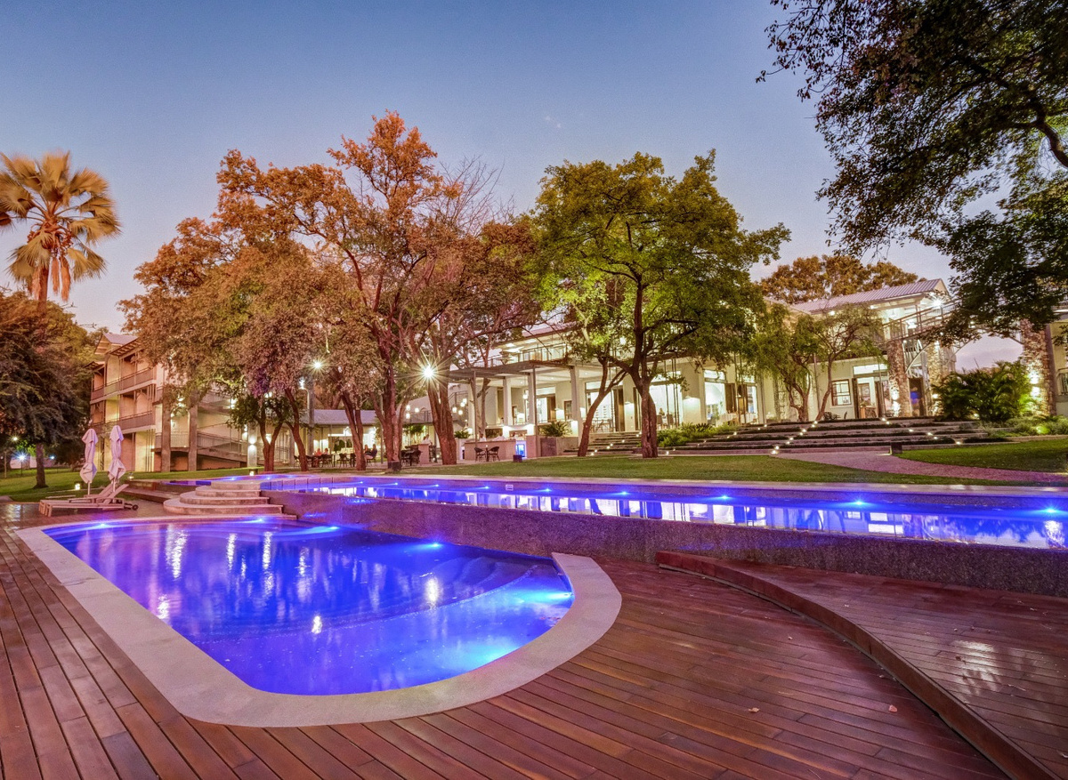 Evening pool overlooking al fresco dining
