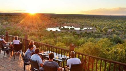 Guests enjoying sundowners at Victoria Falls Safari Lodge's Buffalo Bar.jpg
