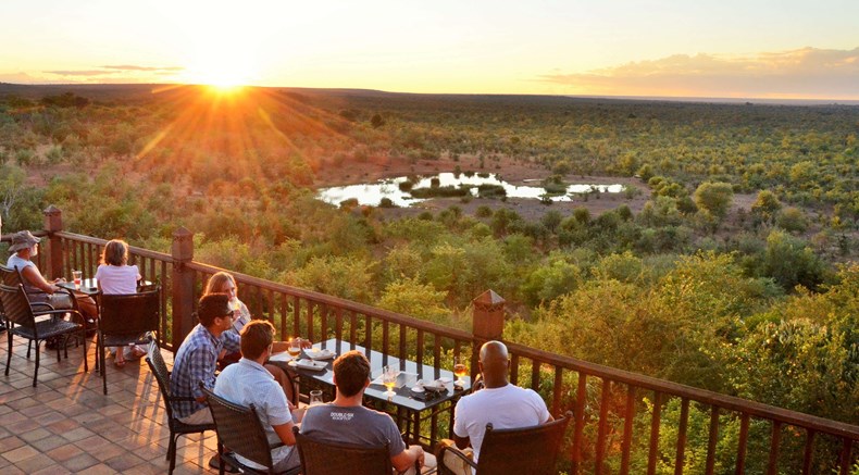 D4D0-guests-enjoying-sundowners-at-victoria-falls-safari-lodges-buffalo-bar.jpg