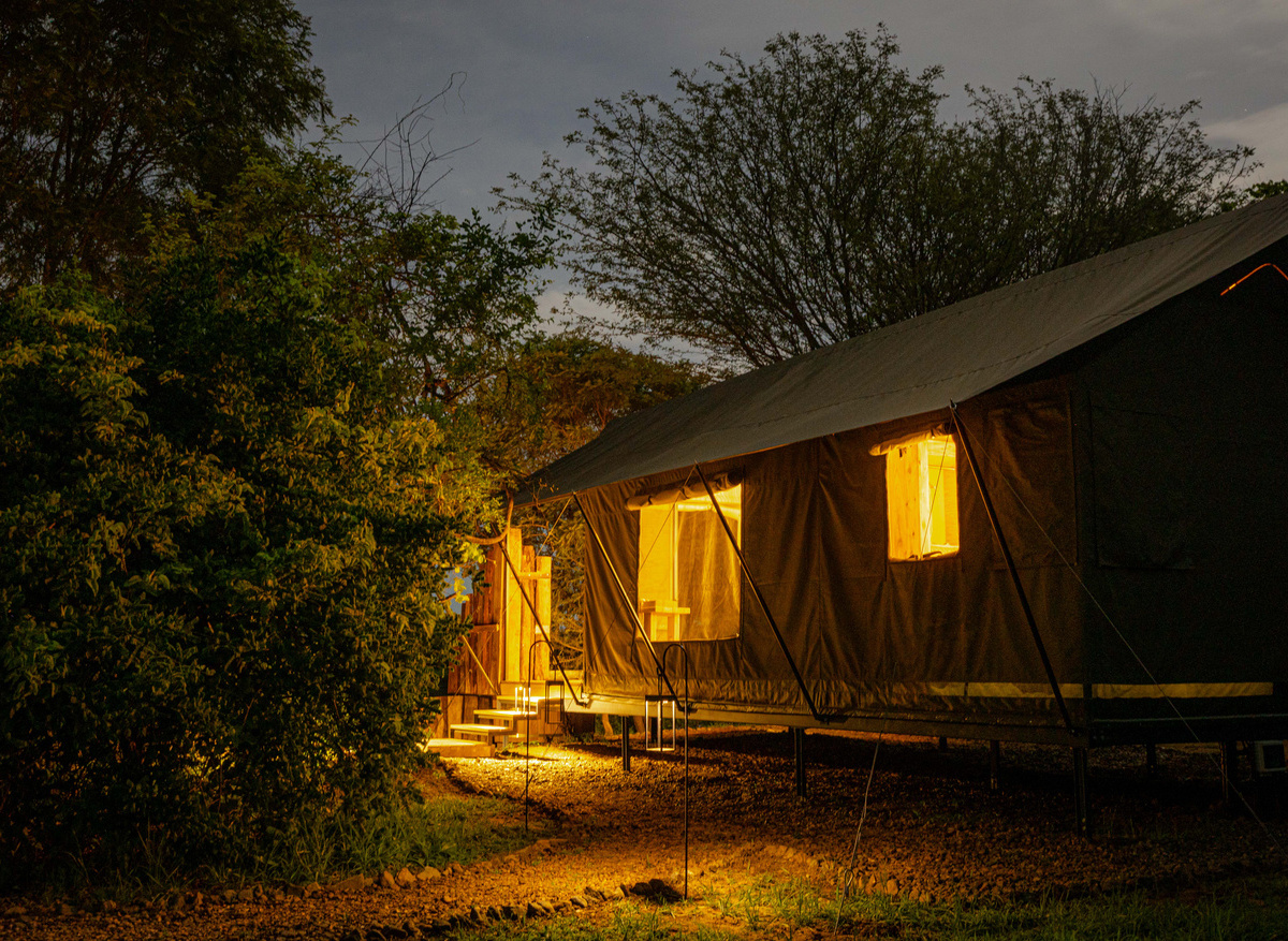 MAWIMBI Bush Camp - one of four exclusive Tented Suites at night