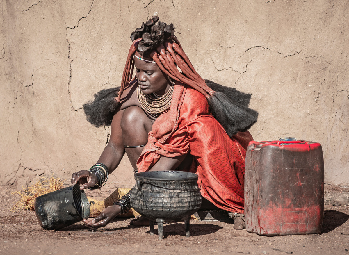 Woman Himba Tribe Preparing Food Himba Village Namibia Africa.jpg