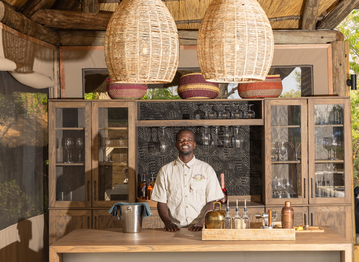 A well stocked bar and service with a smile at Camp Khwai.jpg